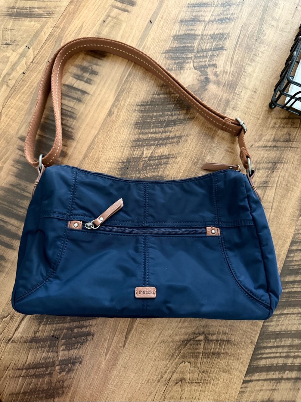 The Sak Navy Shoulder Bag with Tan Trim and Strap